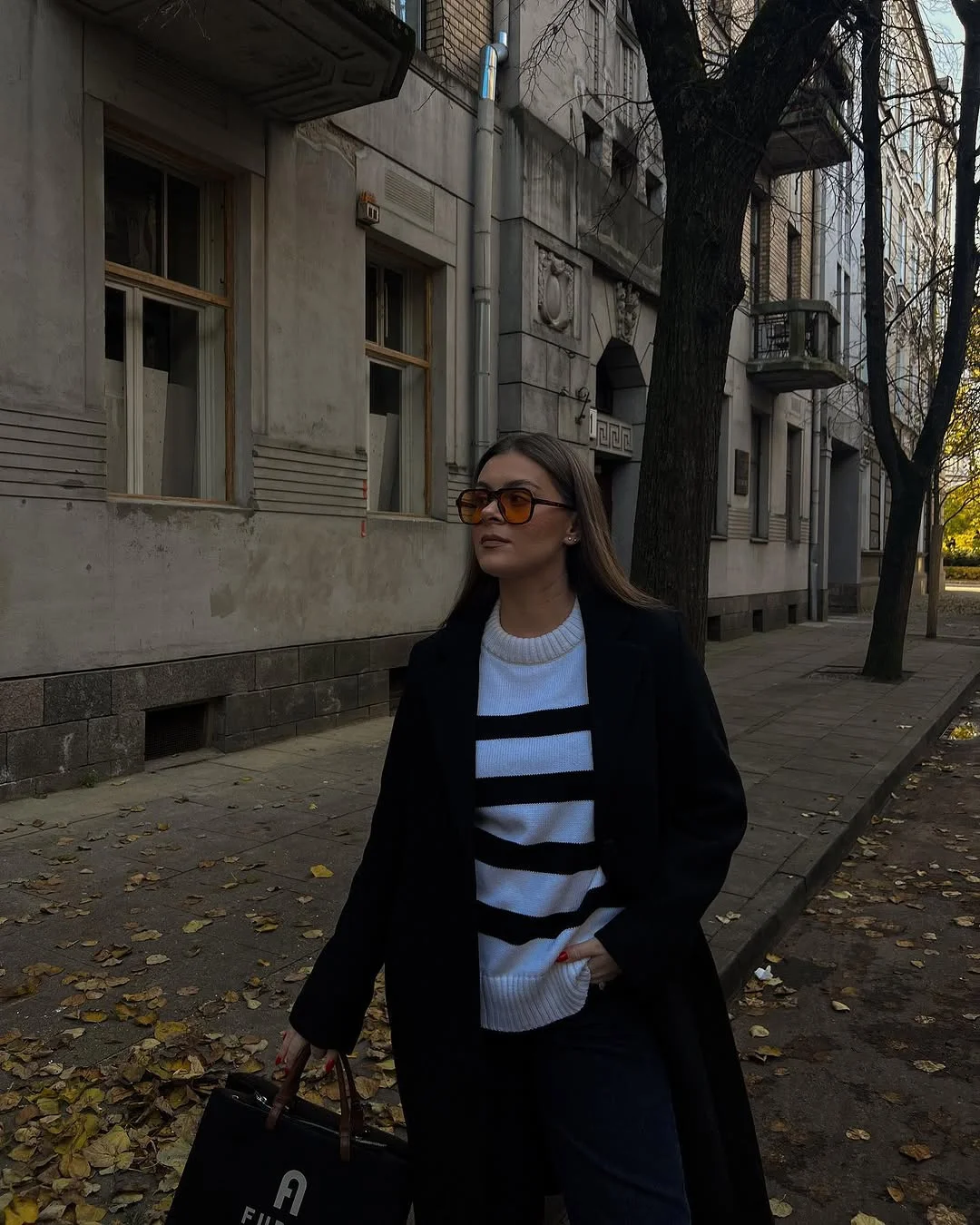 simple fall outfits 2026 Classic Stripes and a Long Black Coat Never Miss