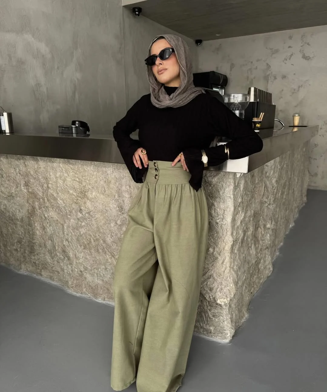 Summer to fall outfits 2026 Soft Olive Trousers And Black Layers Always Feel Elegant