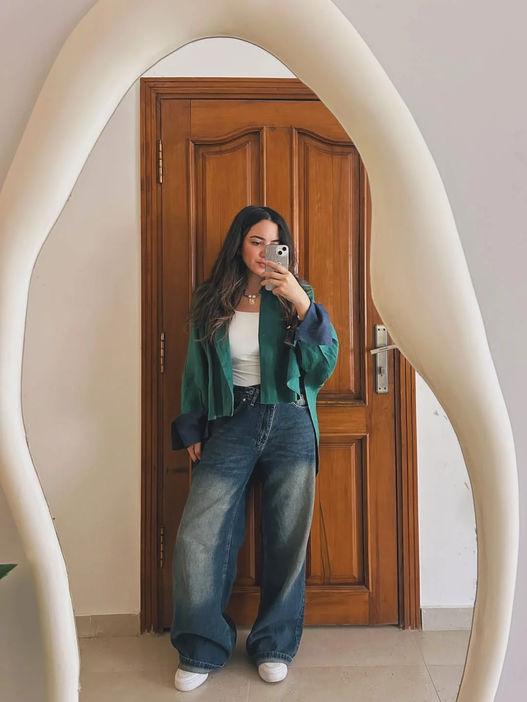 Summer to fall outfits 2026 Relaxed Denim And Emerald Layers Make Casual Dressing Feel Cooler
