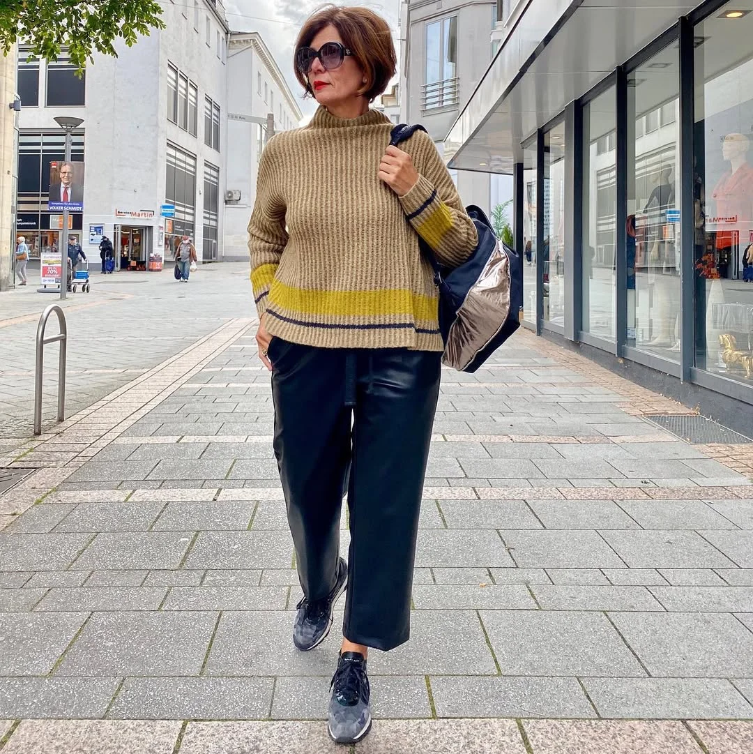 what to wear in fall 2026 over 50 Relaxed Knitwear with Leather Trousers for Effortless City Style