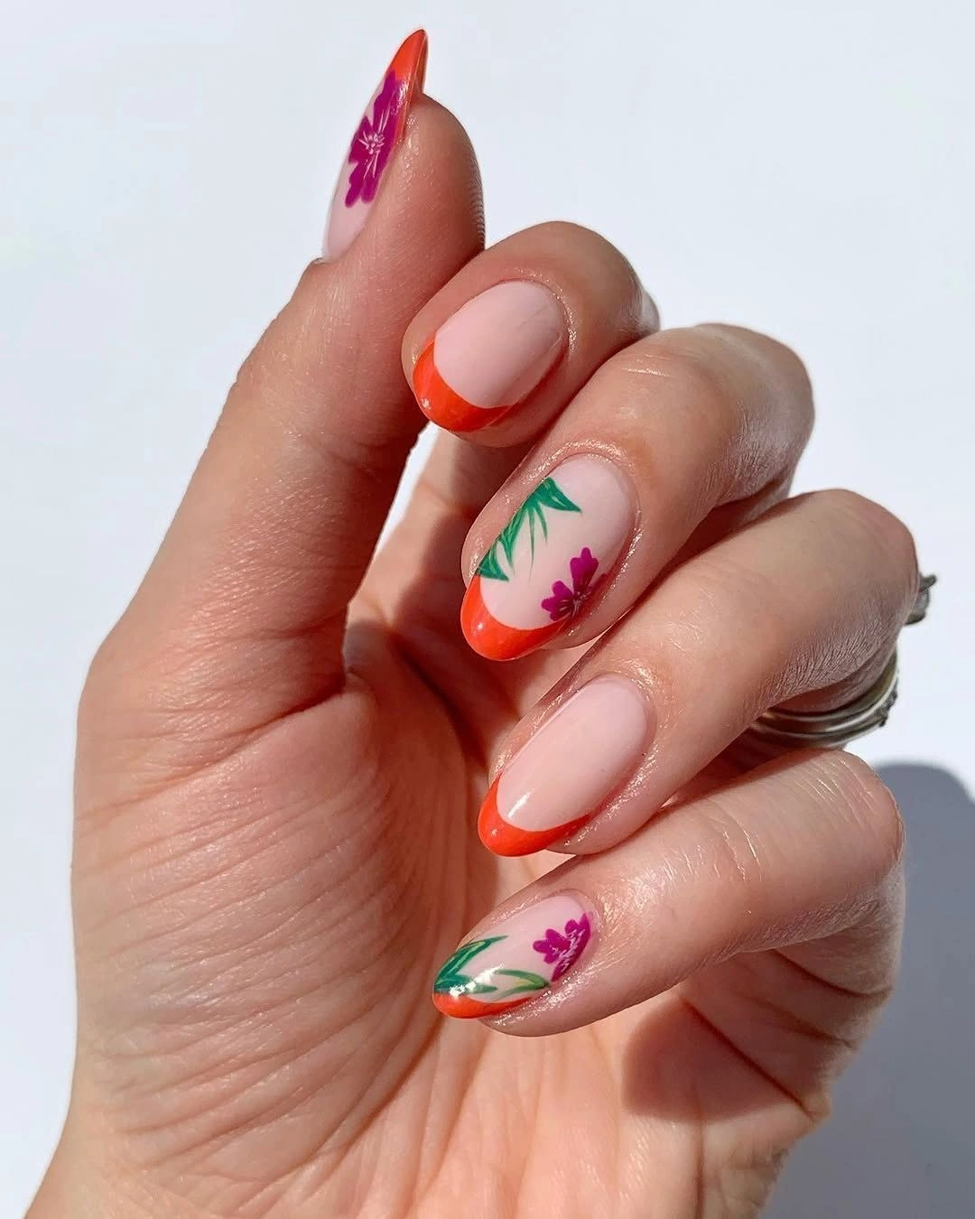 august nails color 2026 Coral French Tips with Delicate Botanical Blooms