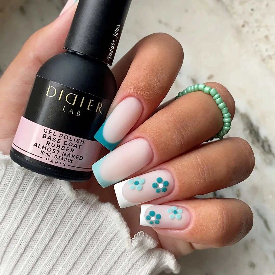 august nails color 2026 Fresh Aqua French Tips with Minimal Floral Details