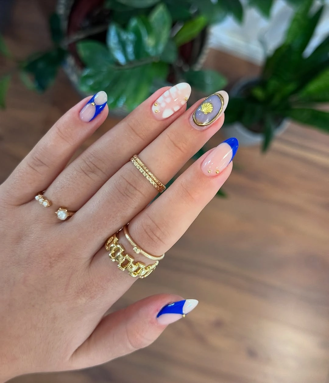 august nails ideas 2026 Royal Blue Statement Nails With Artistic Gold Details