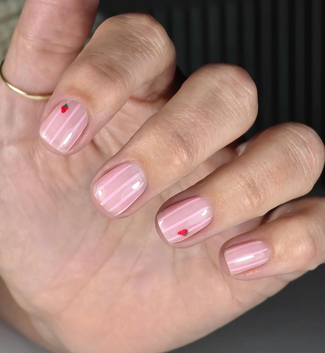 august nails ideas 2026 Sweet Strawberry Stripe Nails With Soft Pink Charm
