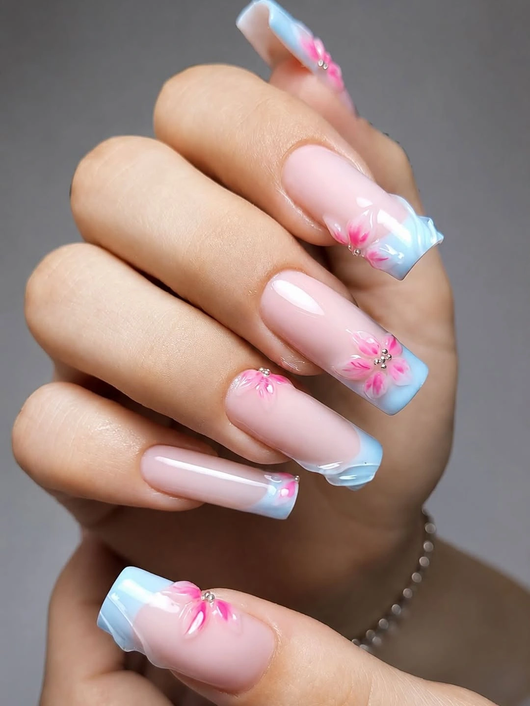 august nails ideas 2026 Dreamy Blue Blossom Nails With Soft Floral Details