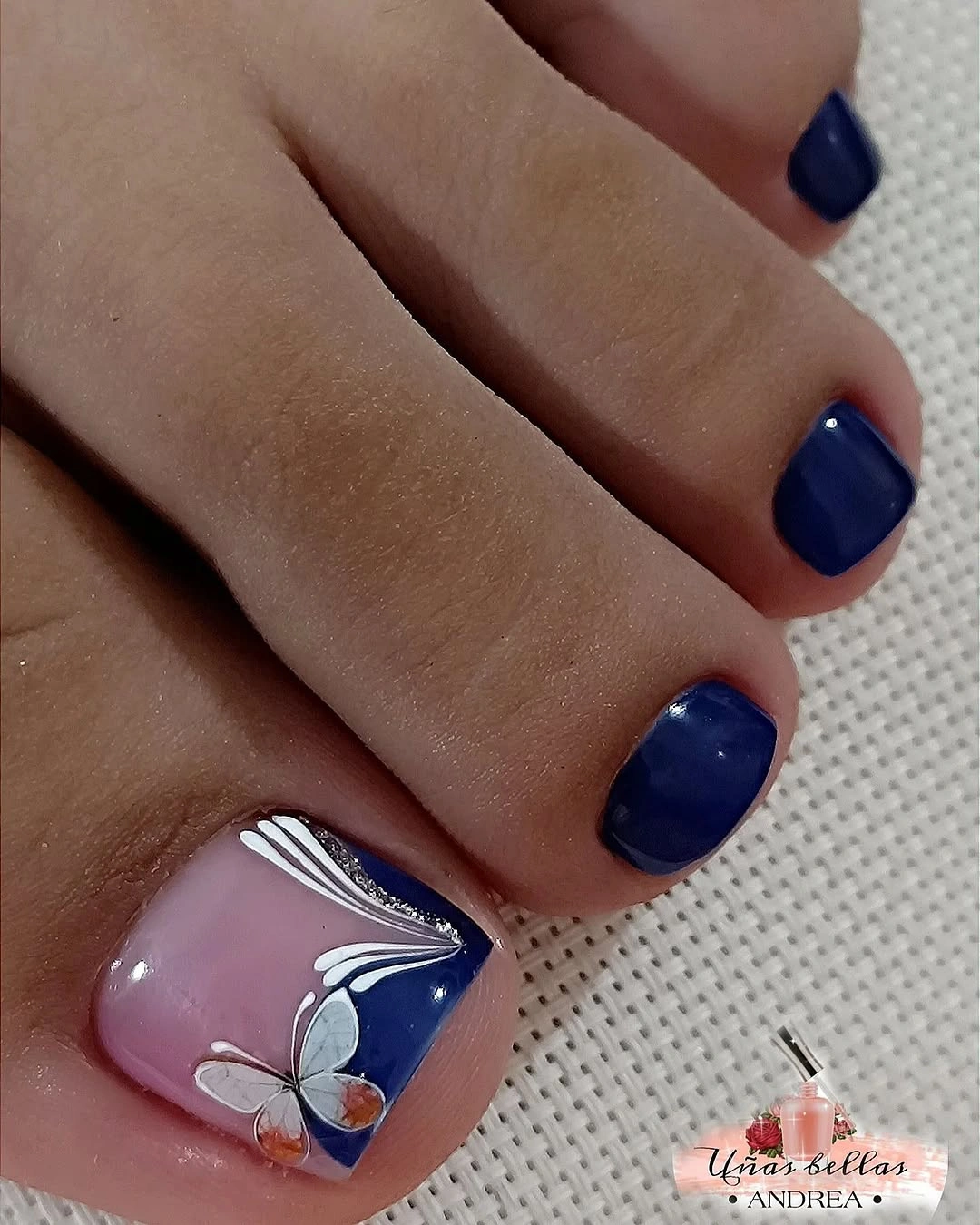 august pedicure nails ideas 2026 Classic Navy Pedicure With Delicate Butterfly Accent