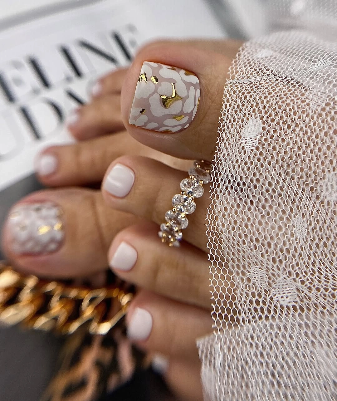 august pedicure nails ideas 2026 Soft Ivory Florals With Luxurious Gold Accents