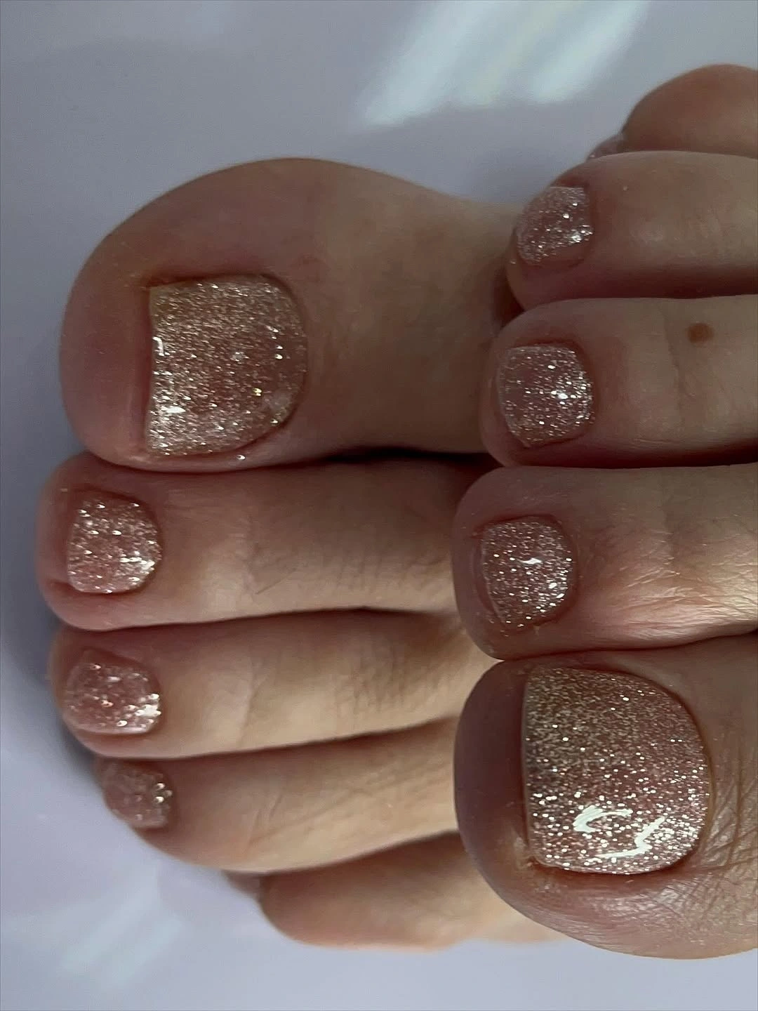 august pedicure nails ideas 2026 Champagne Glitter That Sparkles From Day to Night