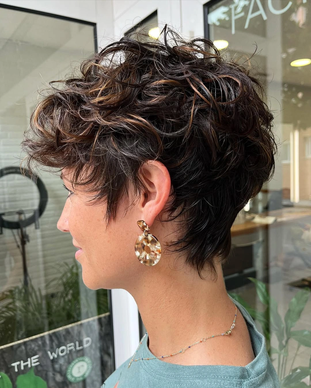 babylights hair ideas Textured Brunette Pixie with Caramel Babylights