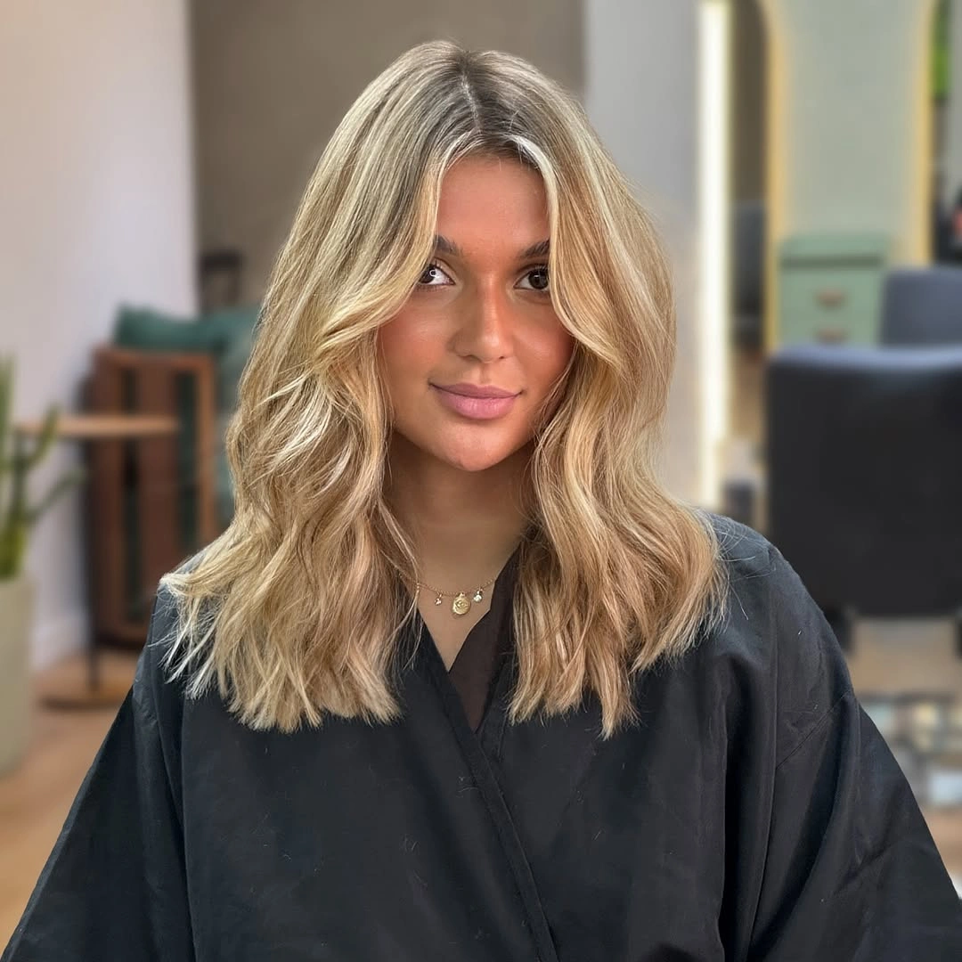 beige blond hair color Soft Layered Beige Blonde with Face-Framing Brightness