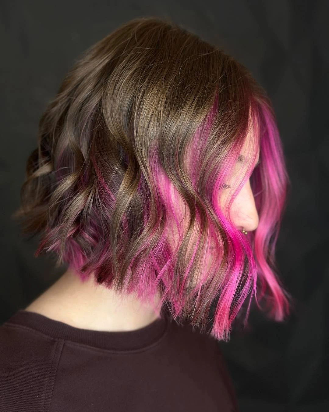 bobbed haircut for women Playful Bob With Vibrant Pink Accent Pieces