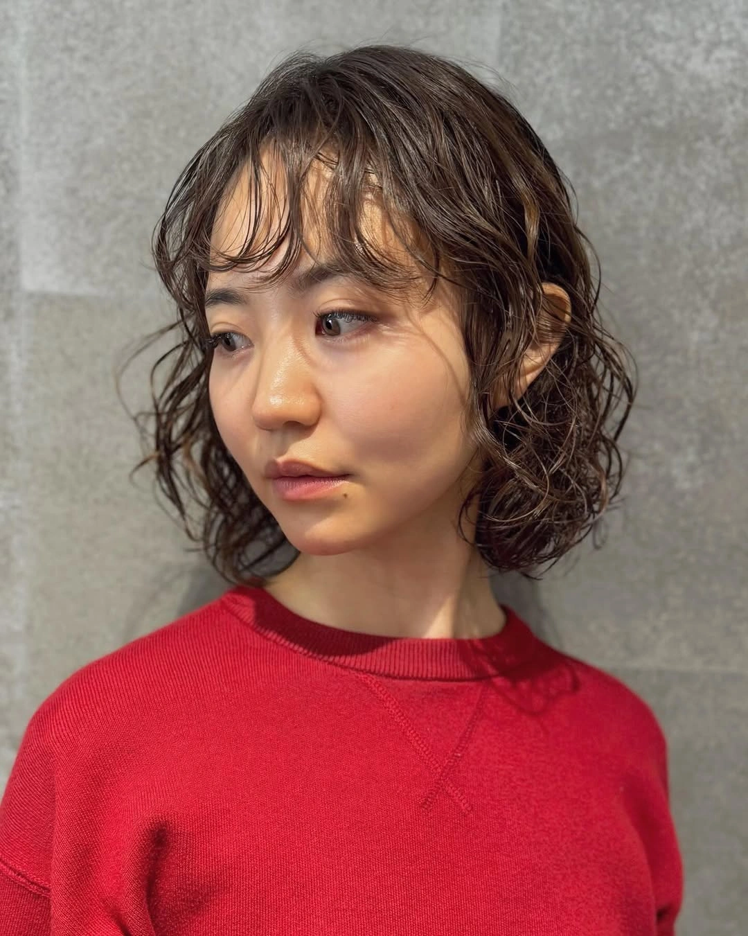 bobbed haircut for women Curly French-Inspired Bob With Wispy Bangs