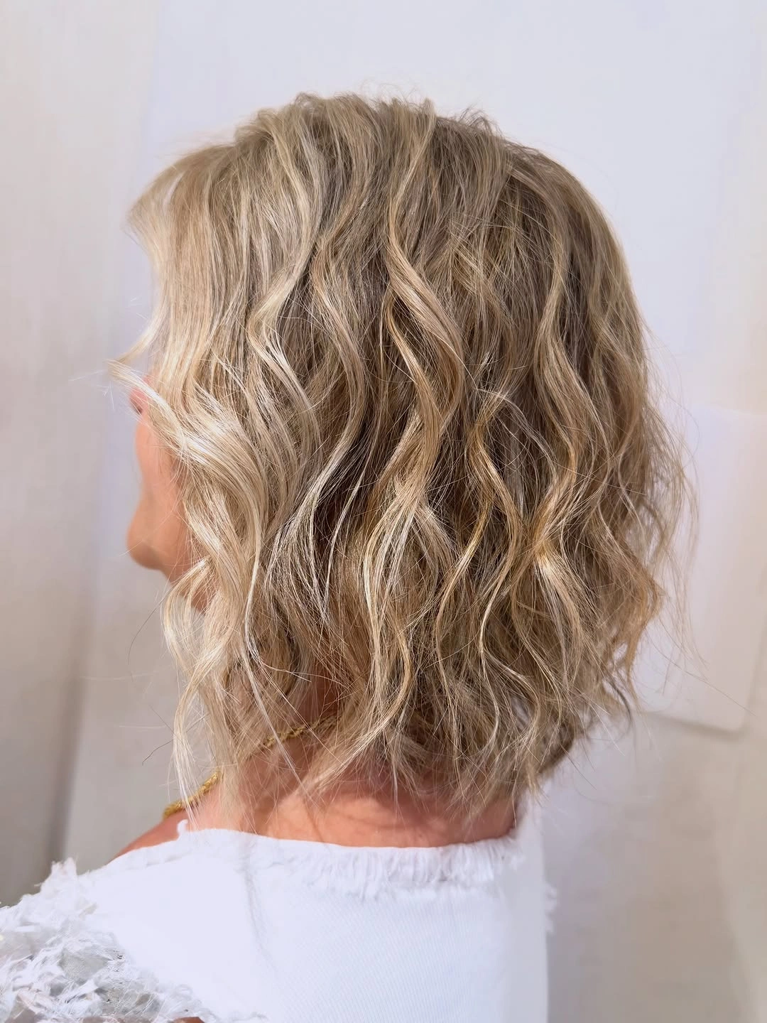 body waves hairstyle Textured Blonde Bob with Relaxed Body Waves