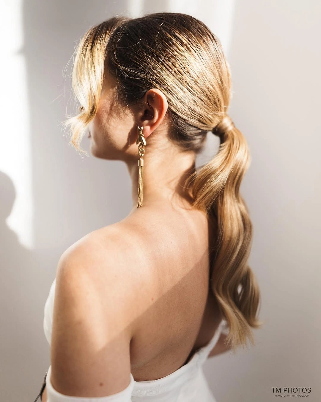 body waves hairstyle Elegant Low Ponytail with Soft Body Waves