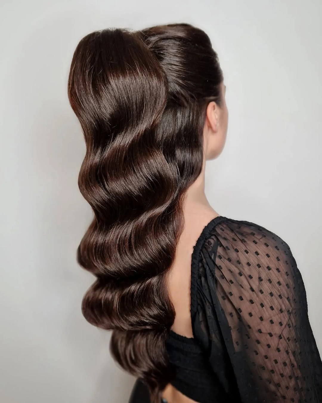 body waves hairstyle Classic Hollywood Body Waves in a Sleek Low Ponytail