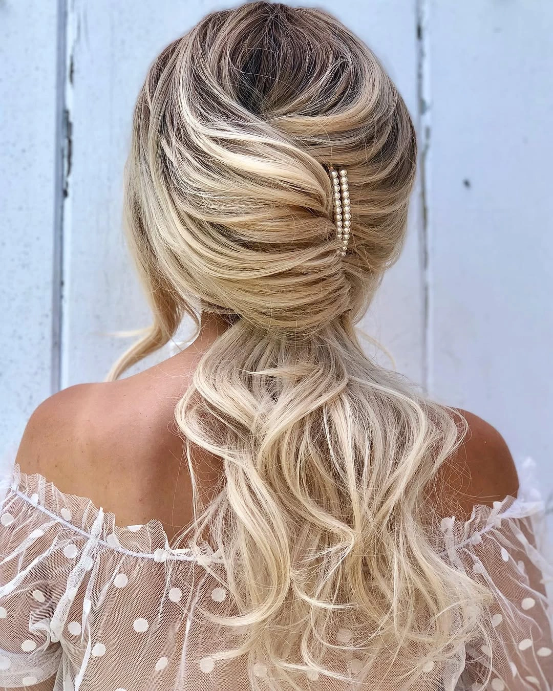 bridesmaid hairstyling Voluminous Low Ponytail with Soft Bridal Texture