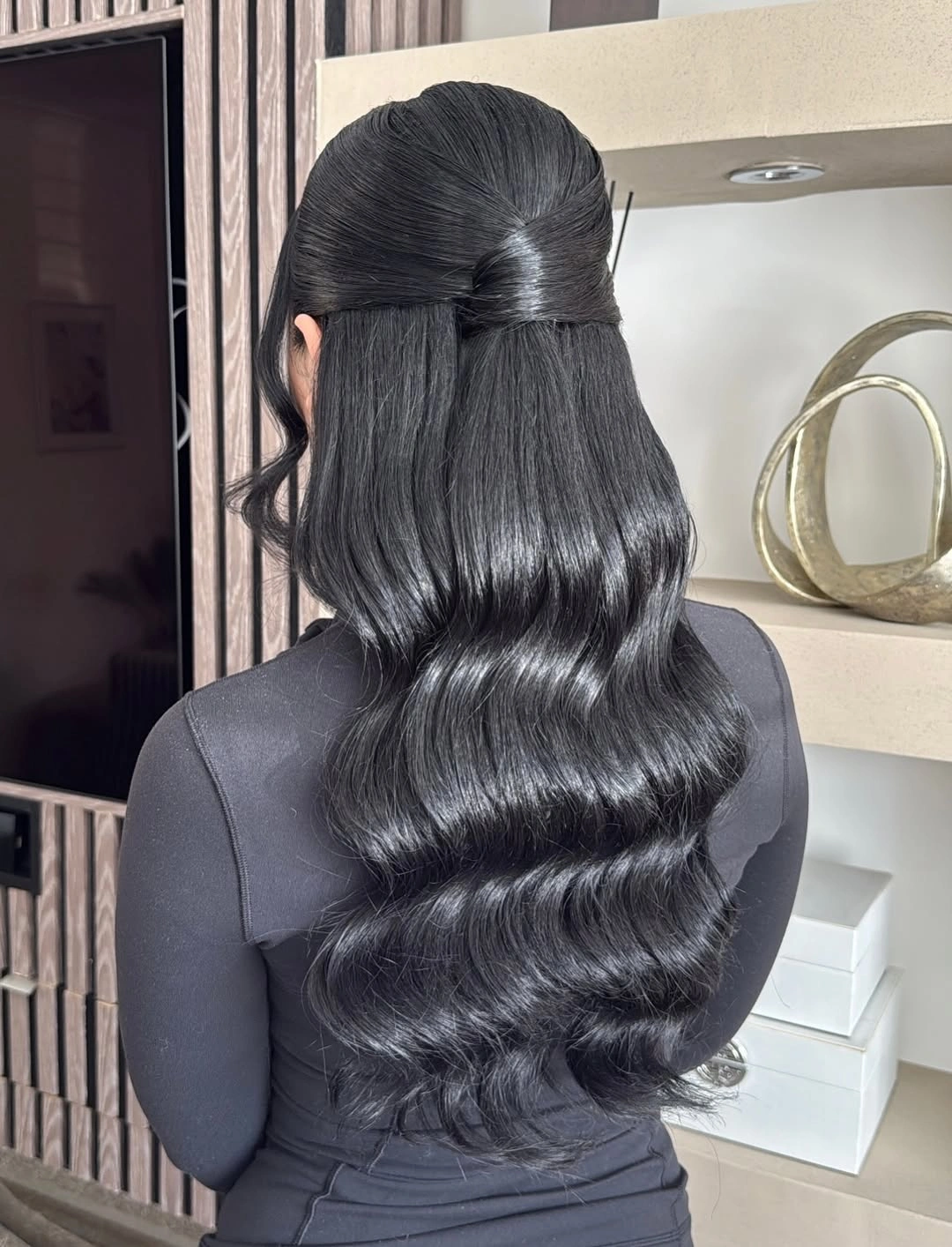 bridesmaid hairstyling Classic Glossy Black Waves with Minimalist Half-Up Styling