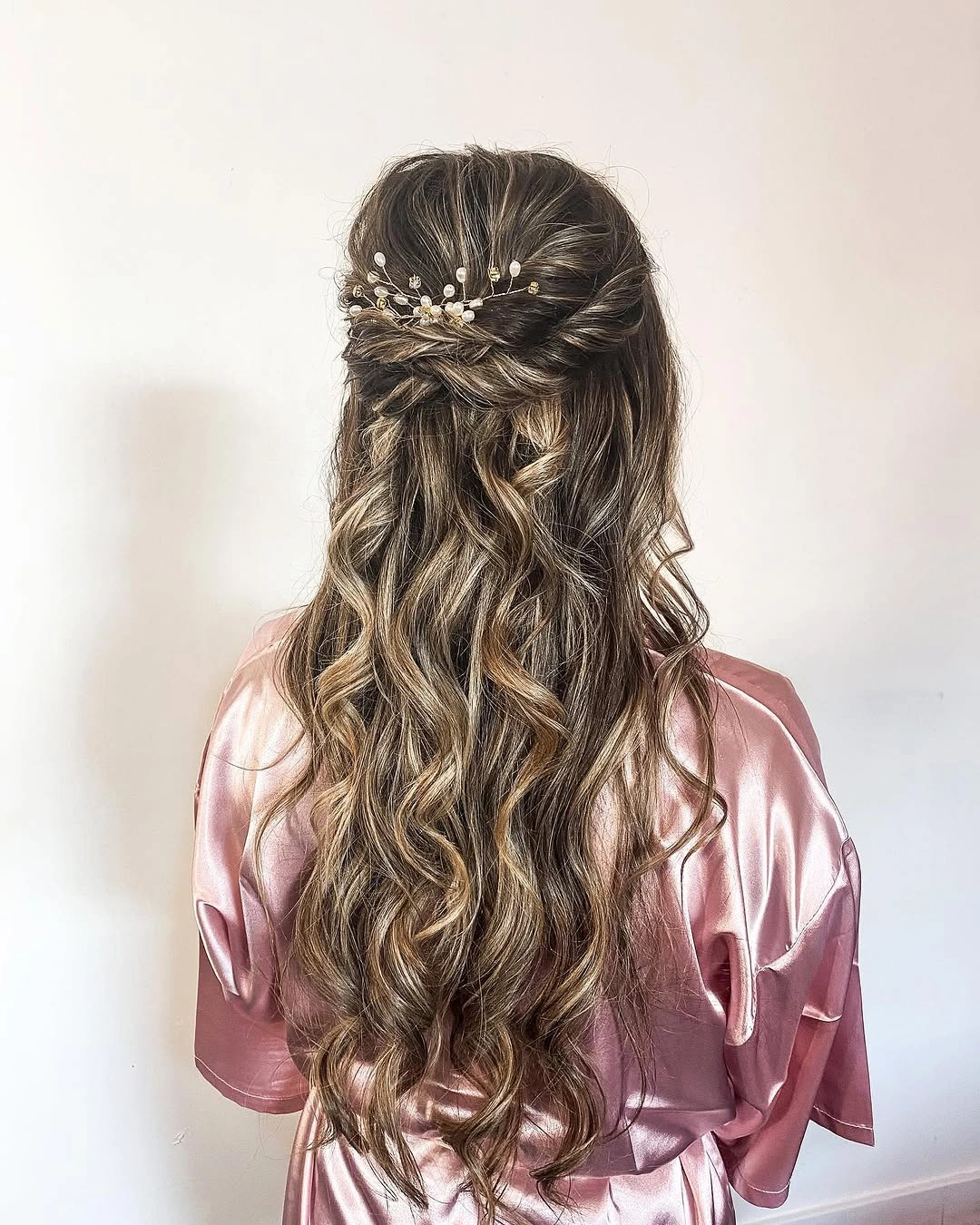 bridesmaid hairstyling Soft Boho Half-Up Curls with Delicate Pearl Details