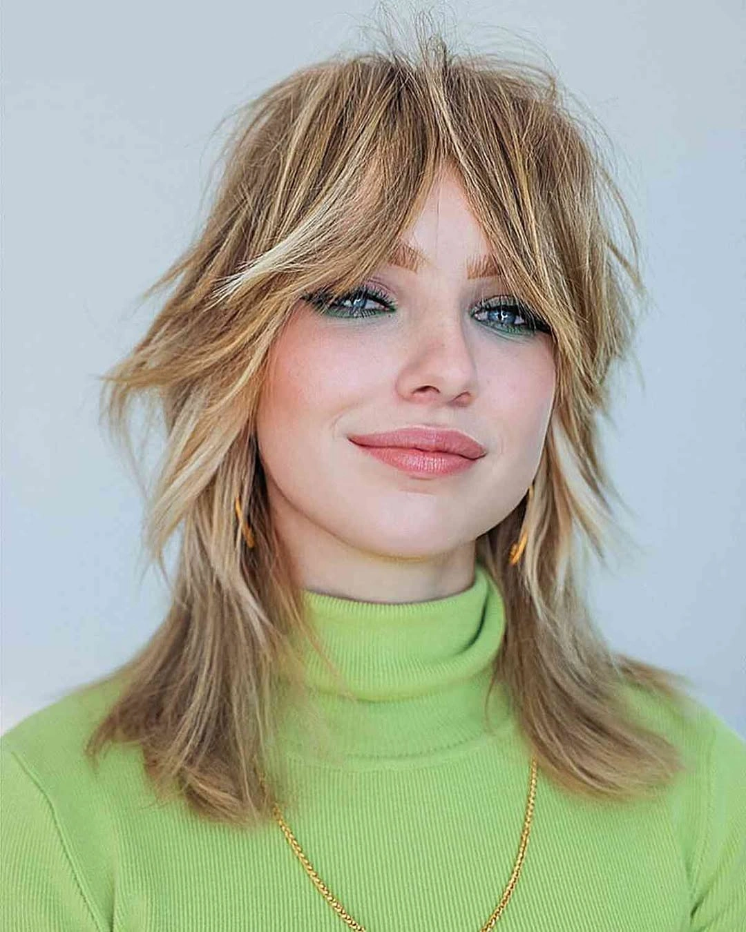 choppy medium layered hair Airy Blonde Shag With Curtain Movement