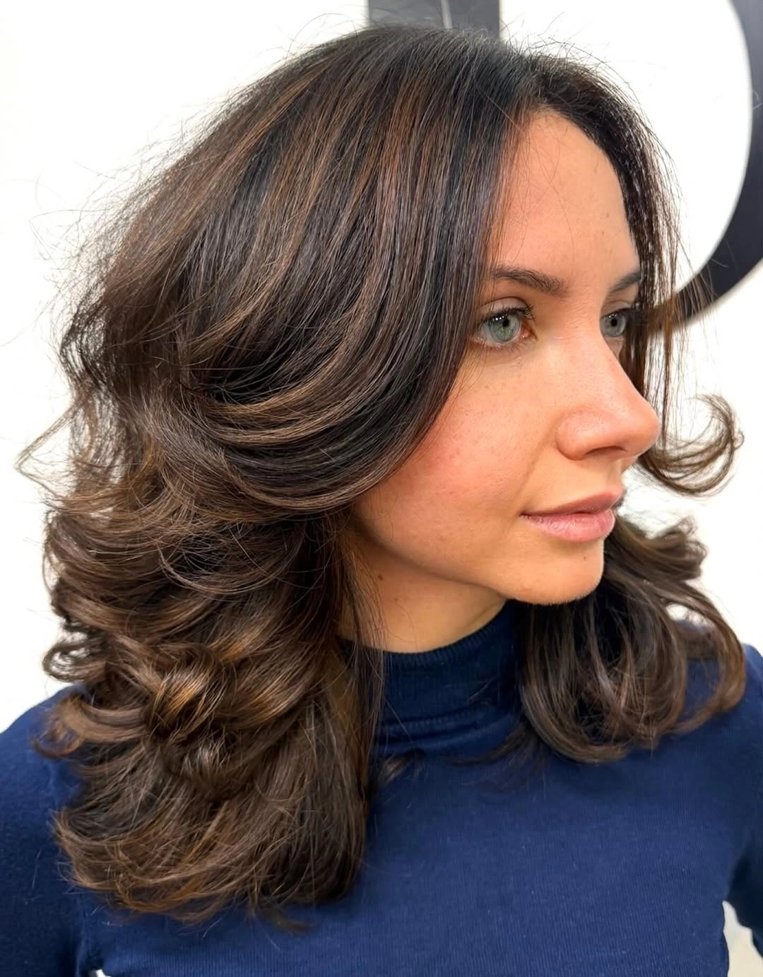 dimensional brunette hair color Side-Swept Brunette Layers With Warm Ribbons