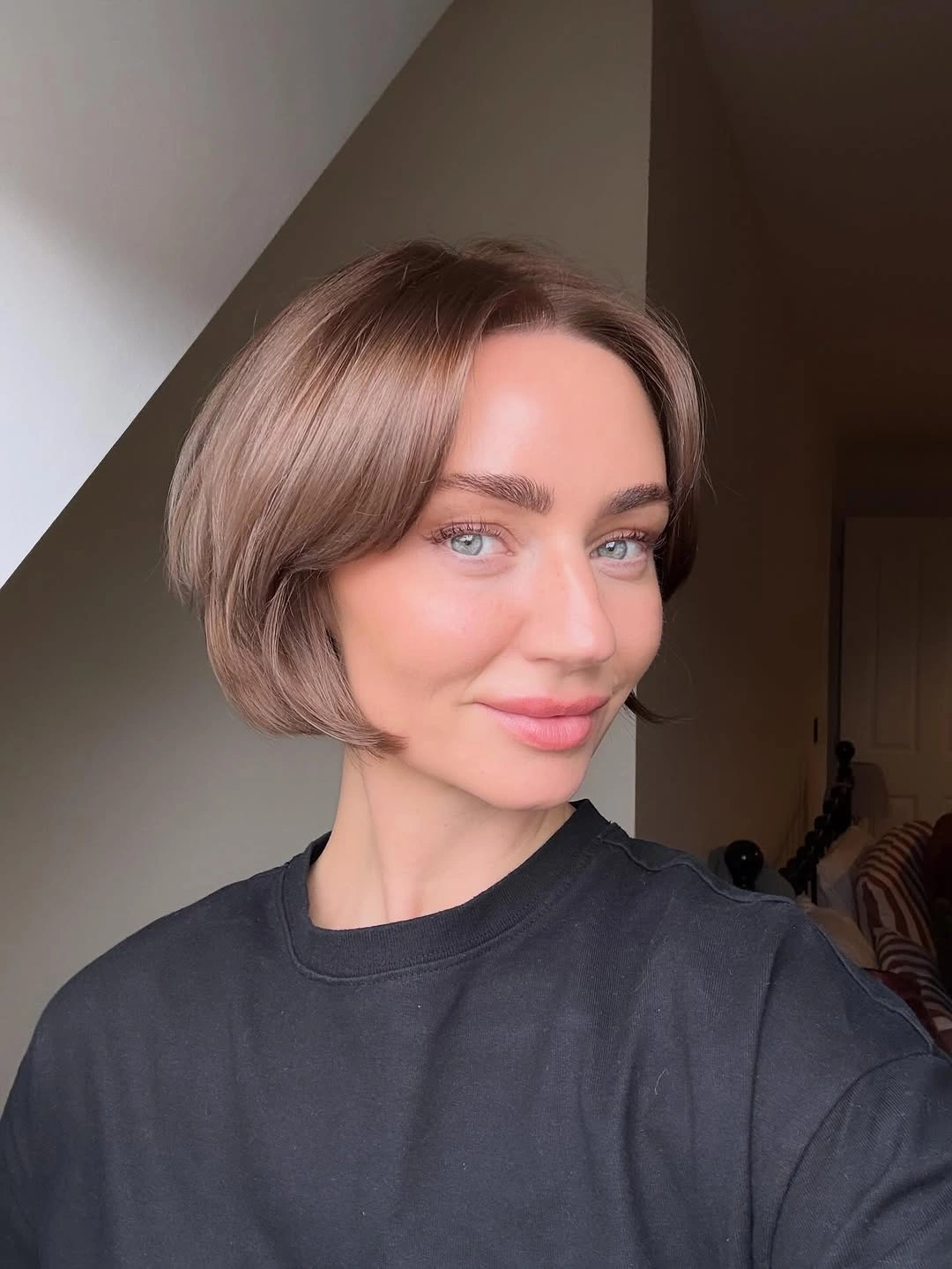 dimensional brunette hair color Short Rounded Brunette Bob With Soft Shine