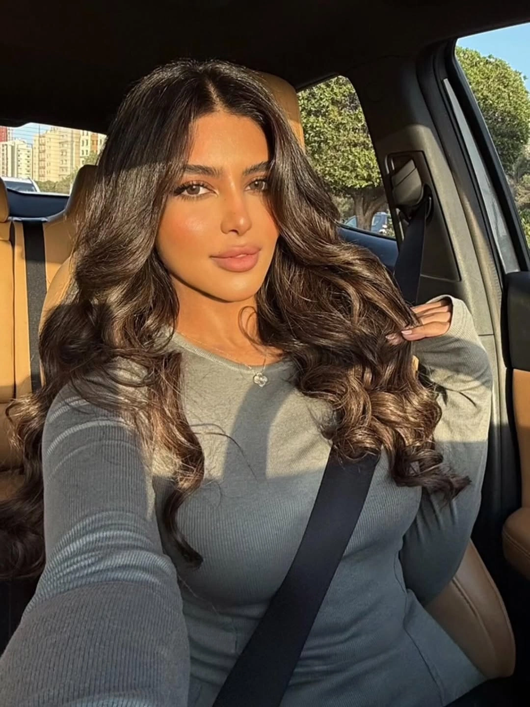 dimensional brunette hair color Sunlit Brunette Waves With Full Volume