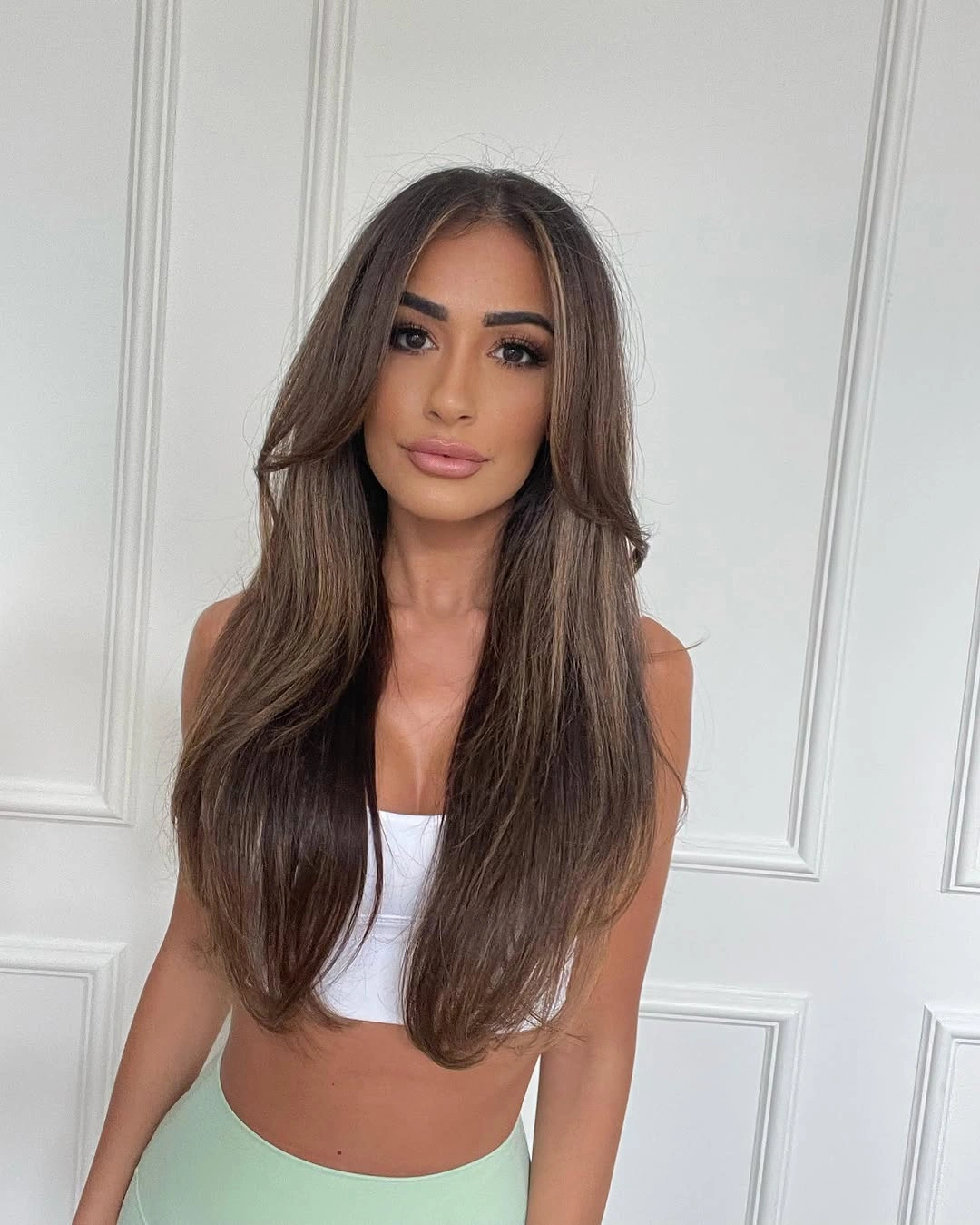 dimensional brunette hair color Long Smooth Brunette With Subtle Face Framing