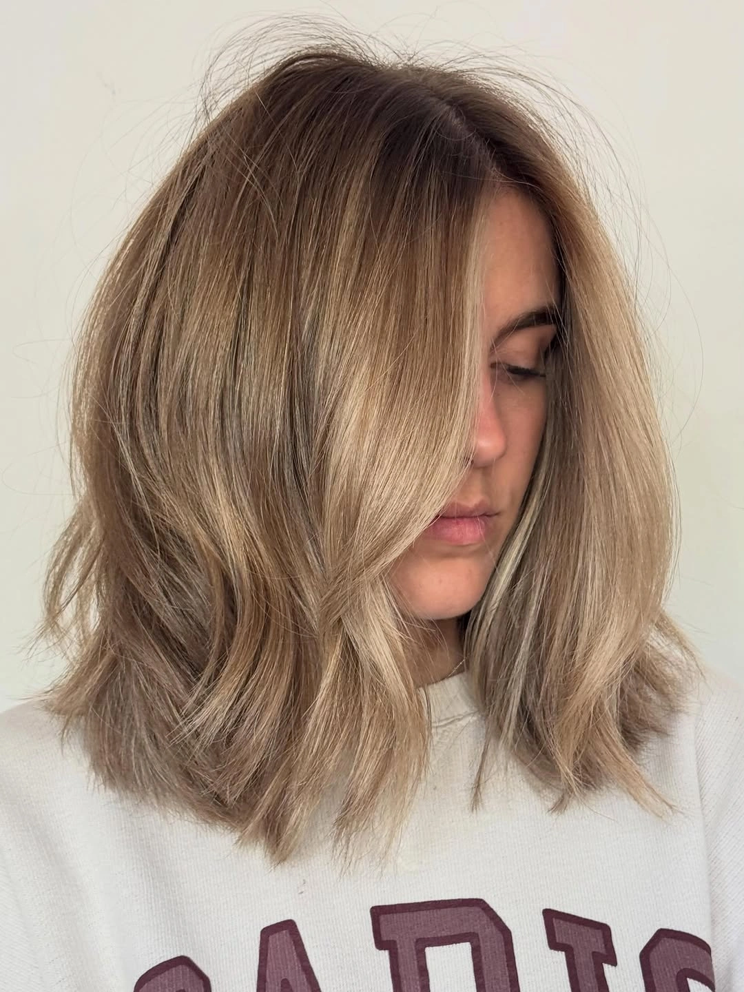 dirty blonde hair color Smoky Beige Dirty Blonde Lob With Effortless Texture