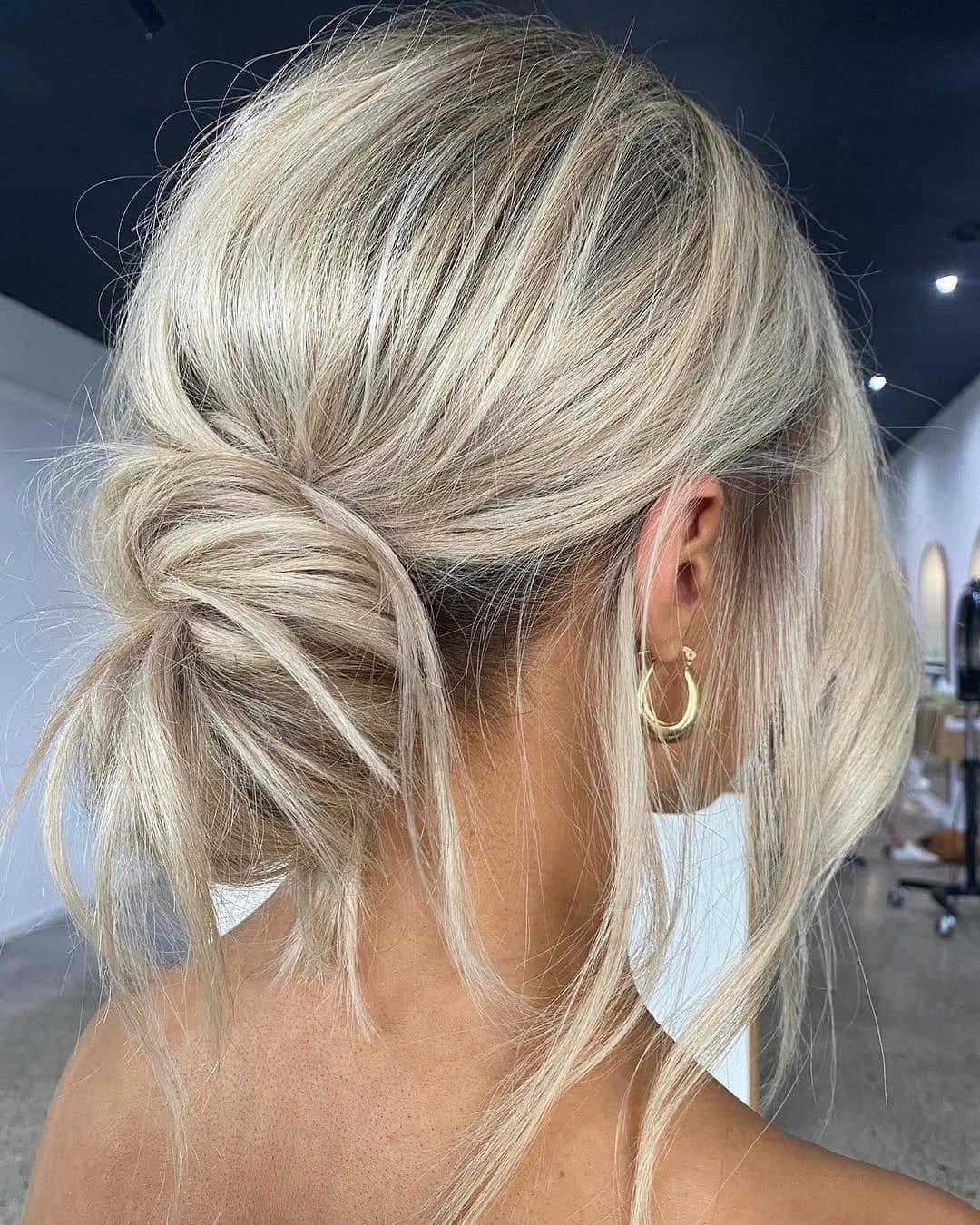 Fall blonde hair colour 2026 Relaxed Blonde Updo With Modern Dimension