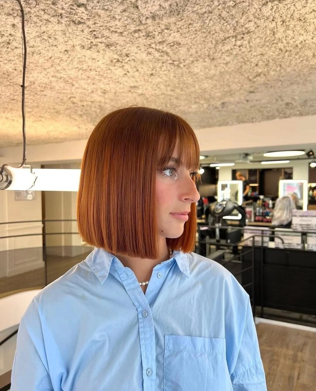 fall bob haircut ideas 2026 Classic Copper Bob With Soft Full Bangs