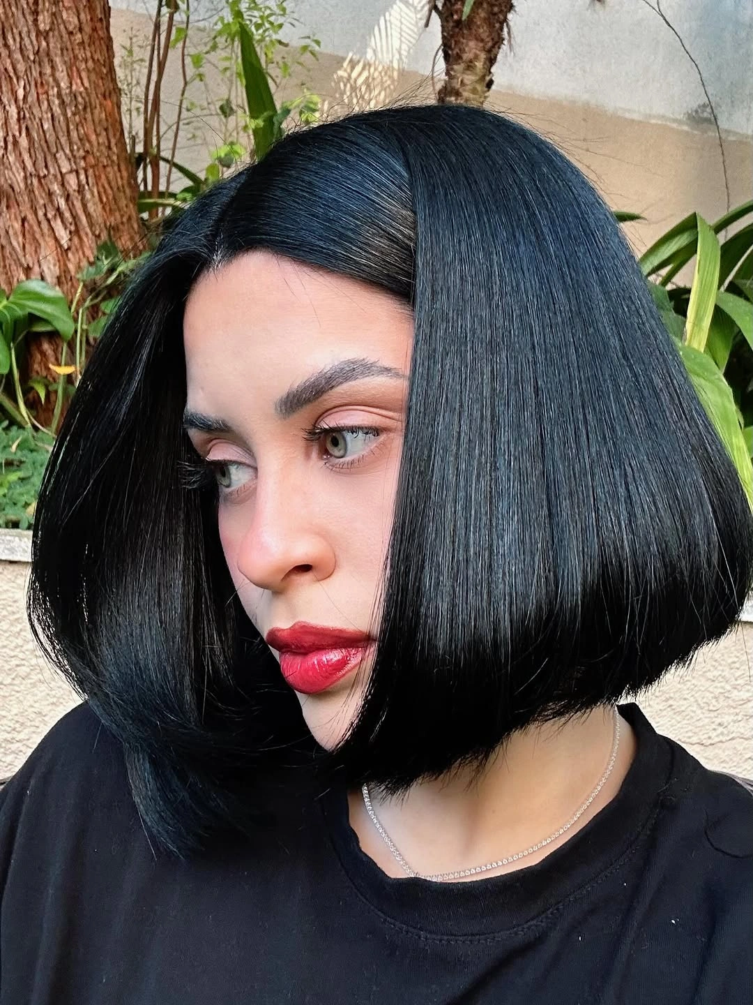 fall bob haircut ideas 2026 Ultra Glossy Jet Black Bob With Dramatic Glass Hair Finish