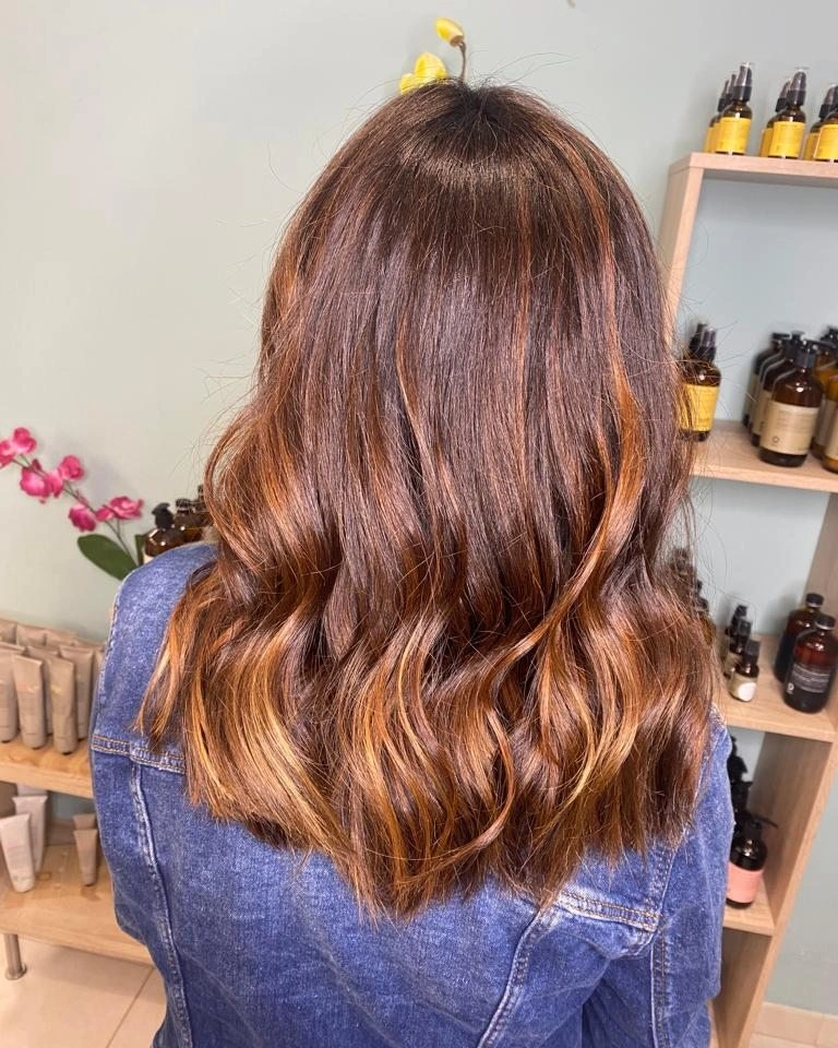 Fall brunette hair colour 2026 Caramel Brunette Balayage with Lived-In Waves