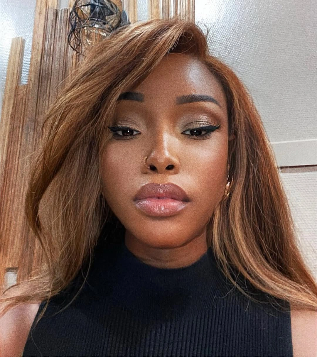 fall hair colors for black women 2026 Golden Chestnut Layers With Soft Face-Framing Brightness