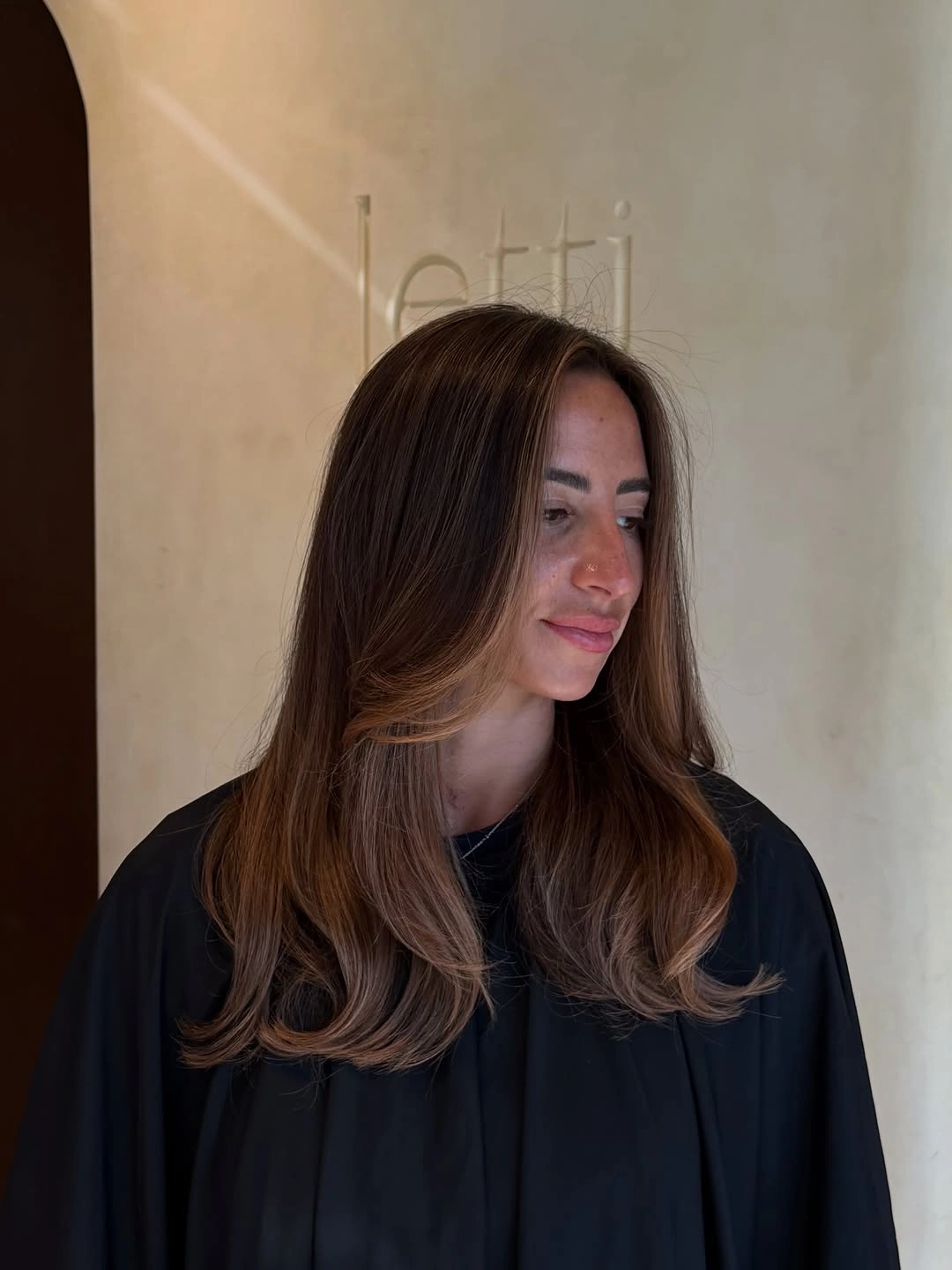 Fall hair colour ideas 2026 Mocha Brunette with Feathered Face-Framing Layers