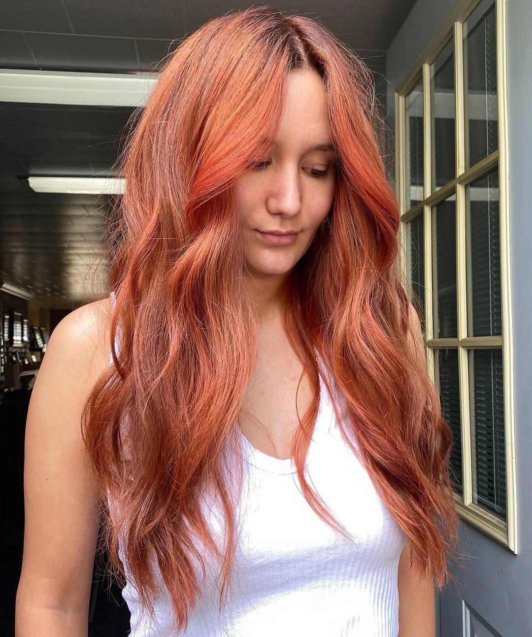 fall haircuts for women 2026 Soft Cinnamon Layers With Airy Curtain Bangs