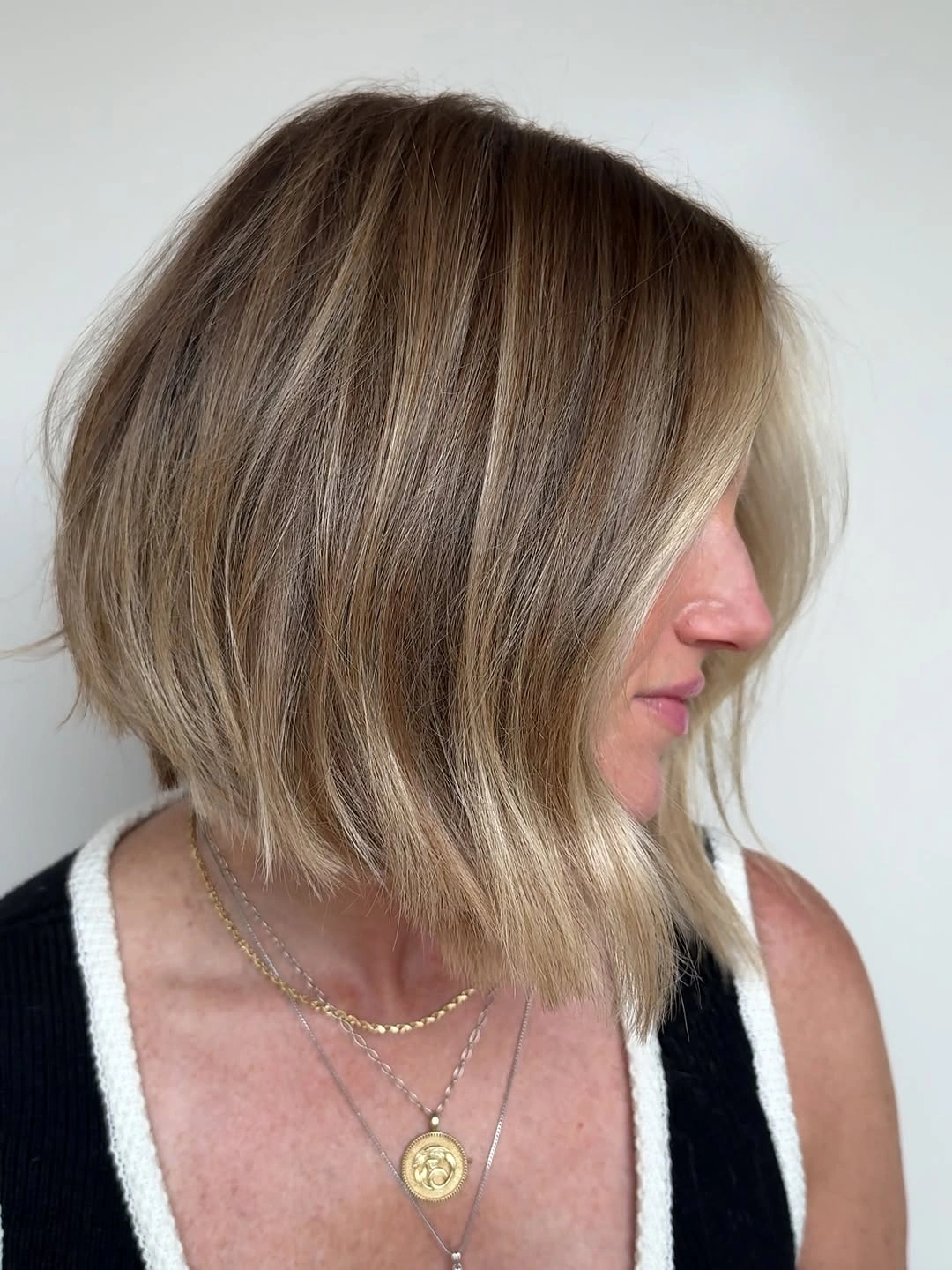 fall haircuts for women 2026 Precision Blonde Blunt Bob With Soft Face-Framing Layers