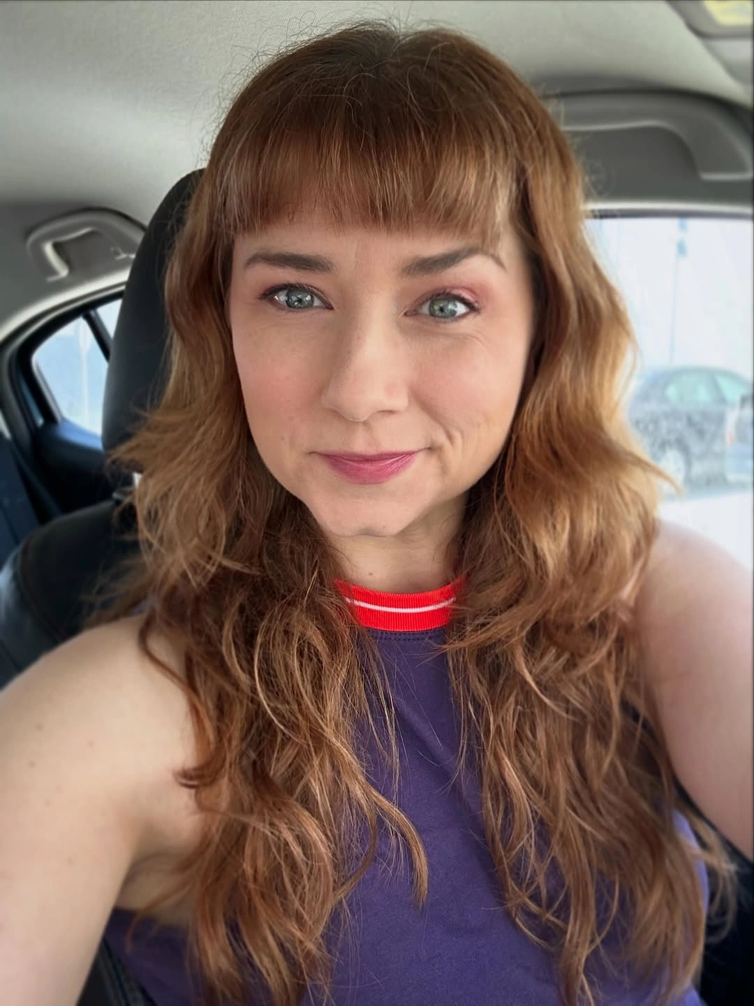 fall haircuts for women 2026 Soft Ginger Waves With Modern Micro Bangs