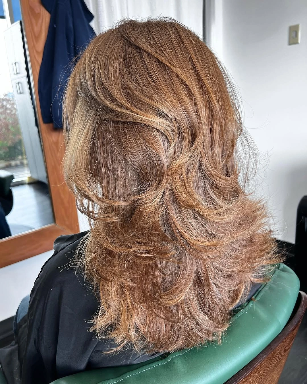 fall haircuts for women 2026 Feathered Mocha Layers With Soft Blowout Volume