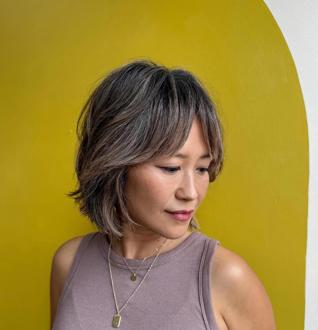 fall hairstyles 2026 Soft Layered Bob with Wispy Curtain Bangs