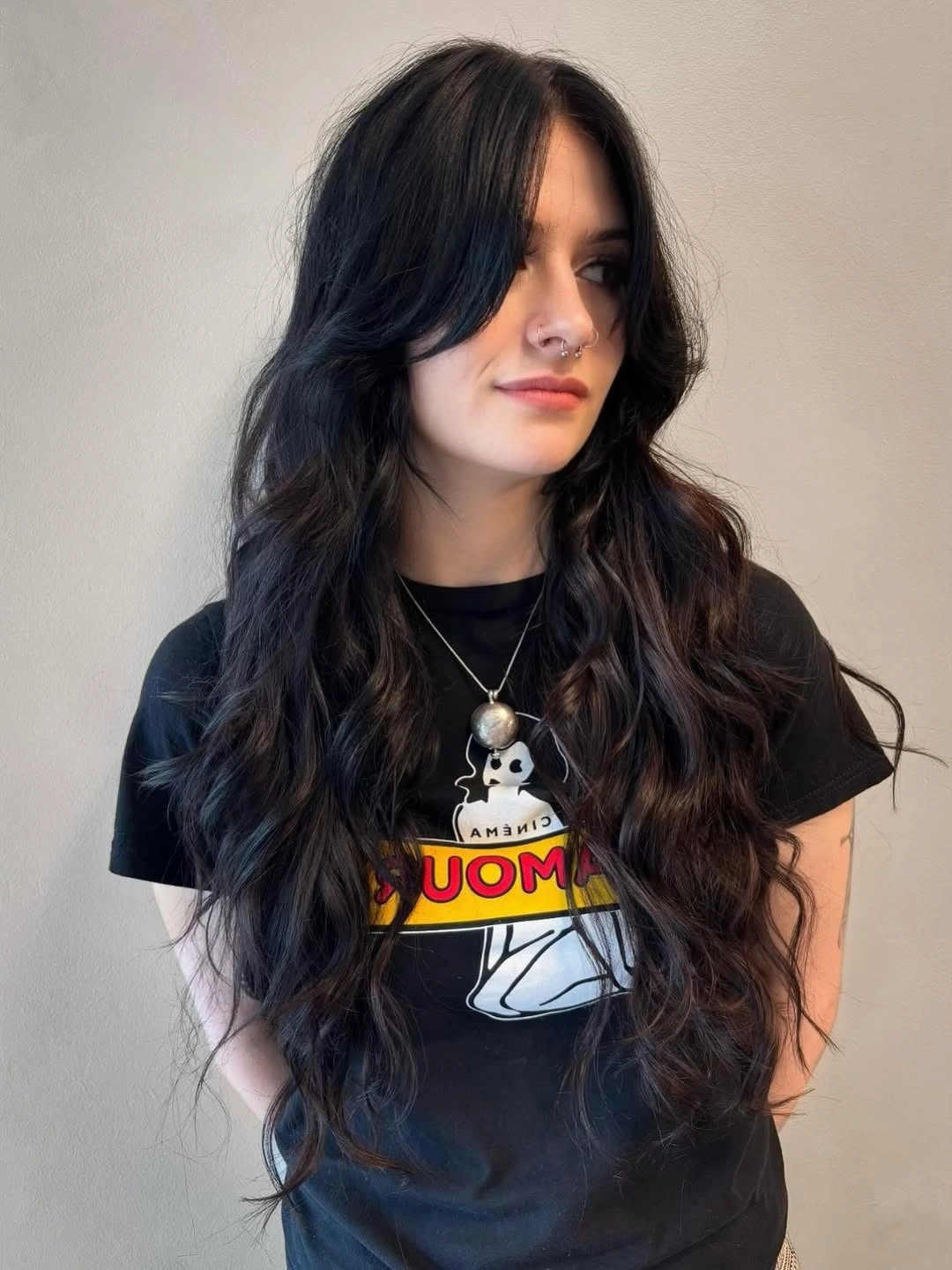 fall hairstyles for long hair 2026 Soft Black Waves with Curtain Bangs for Everyday Cool