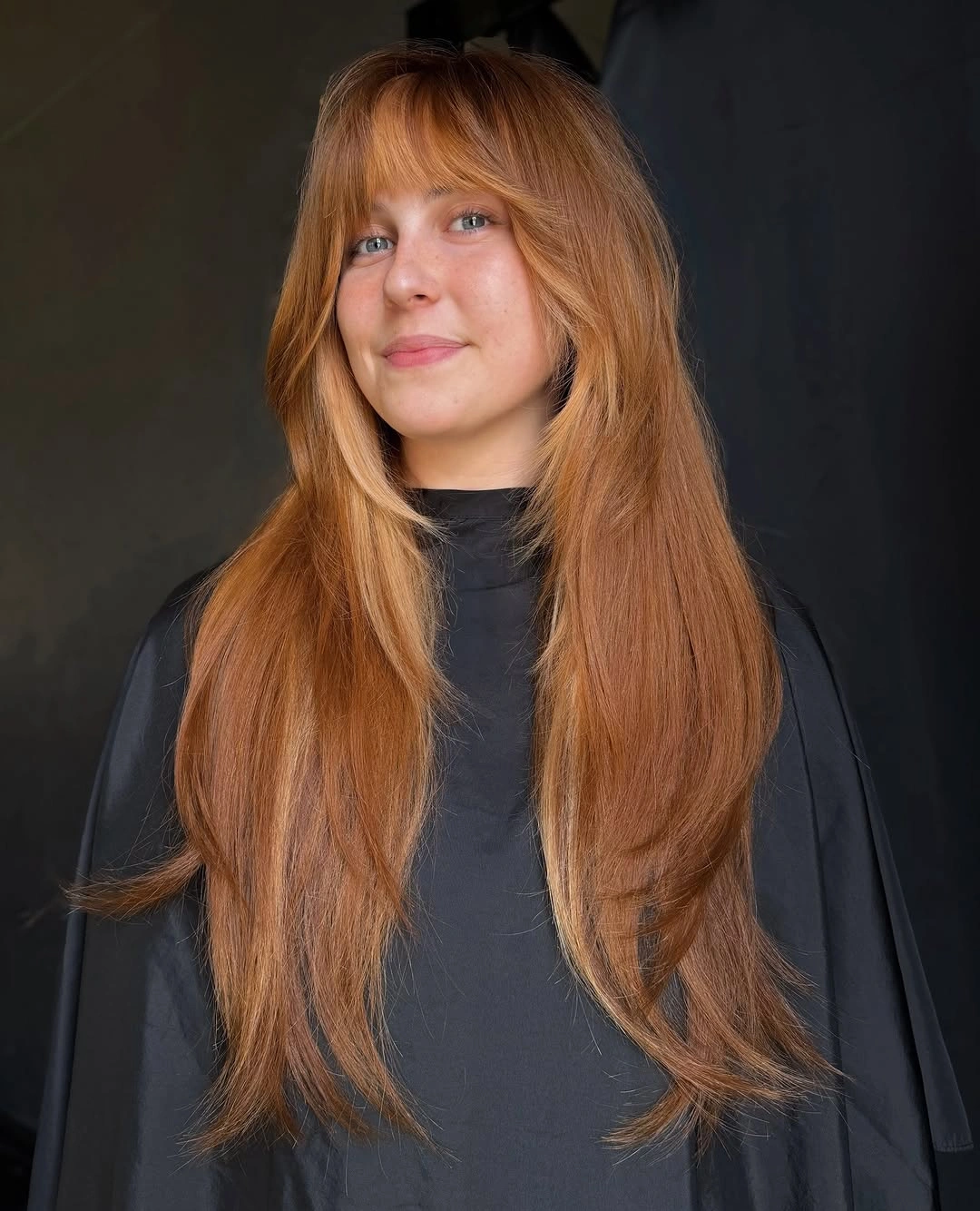 fall hairstyles for long hair 2026 Warm Cinnamon Layers with Soft Bangs