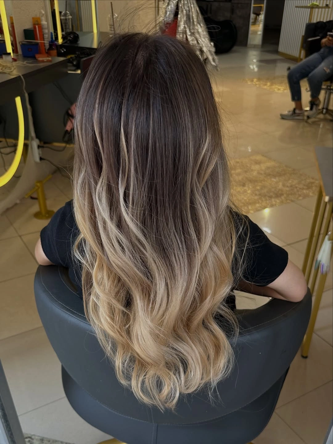 Fall hairstyles for office 2026 Dimensional Balayage Waves for a Relaxed Professional Look