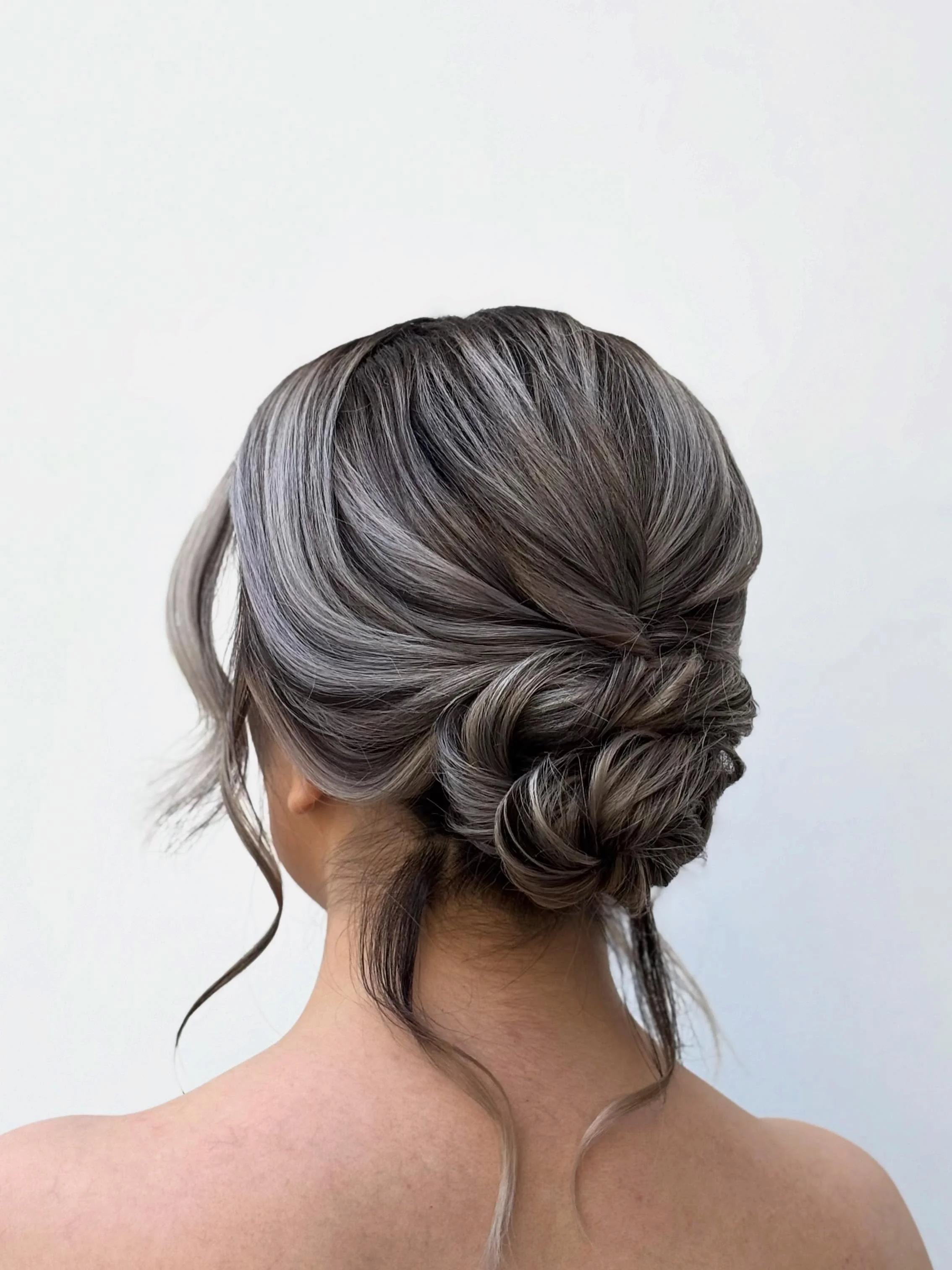 Fall hairstyles for office 2026 Low Textured Chignon for Timeless Office Sophistication