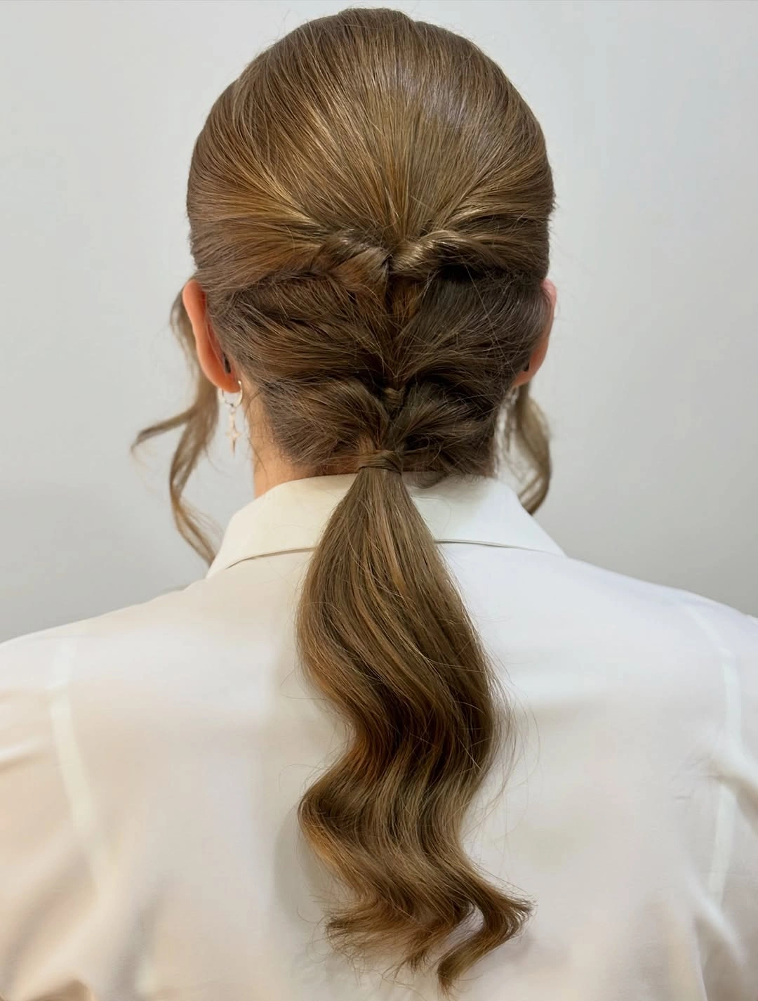 Fall hairstyles for office 2026 Elegant Braided Low Ponytail for a Modern Office Look