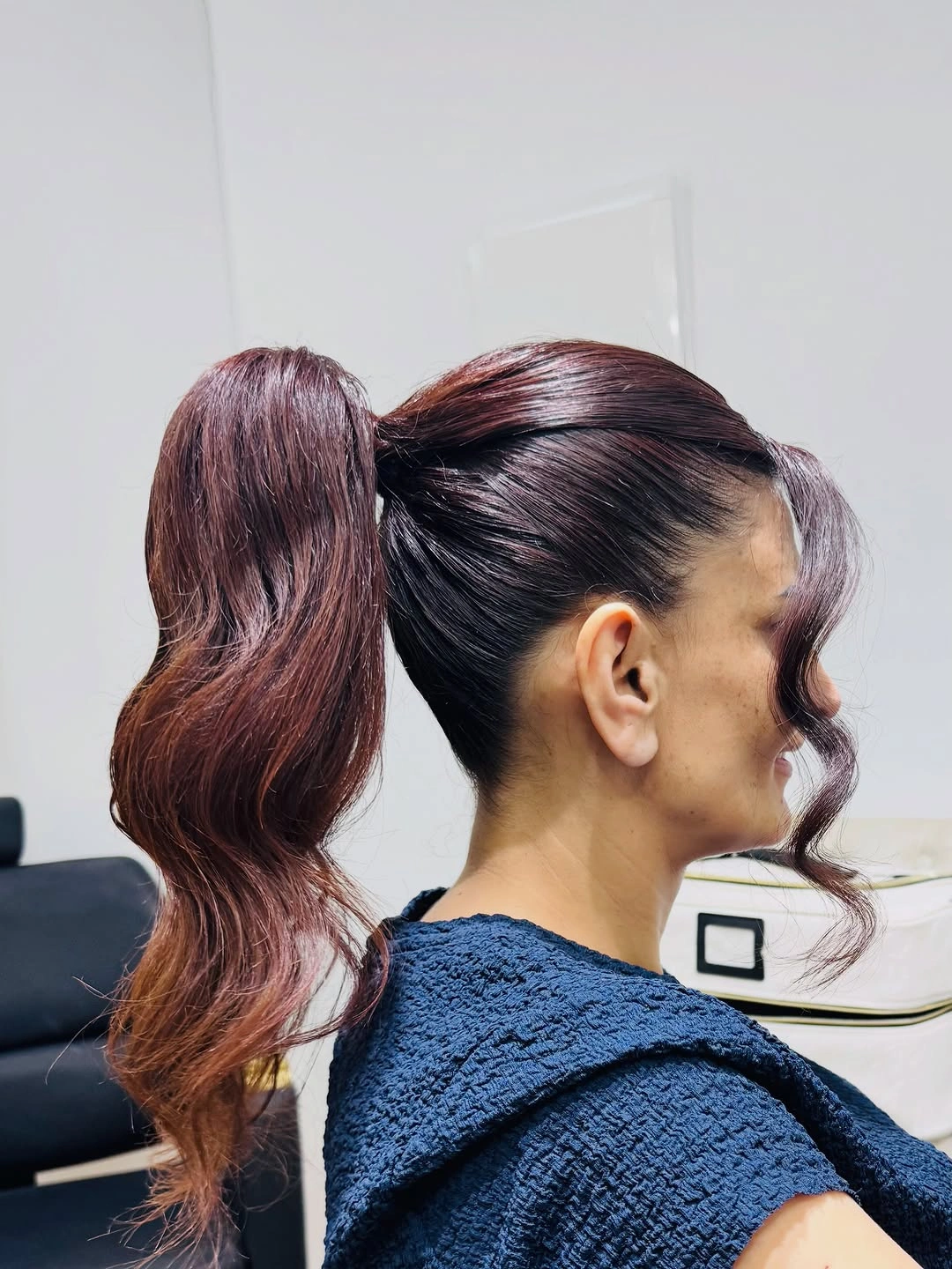 Fall hairstyles for office 2026 Sleek Burgundy Ponytail with Modern Office Elegance