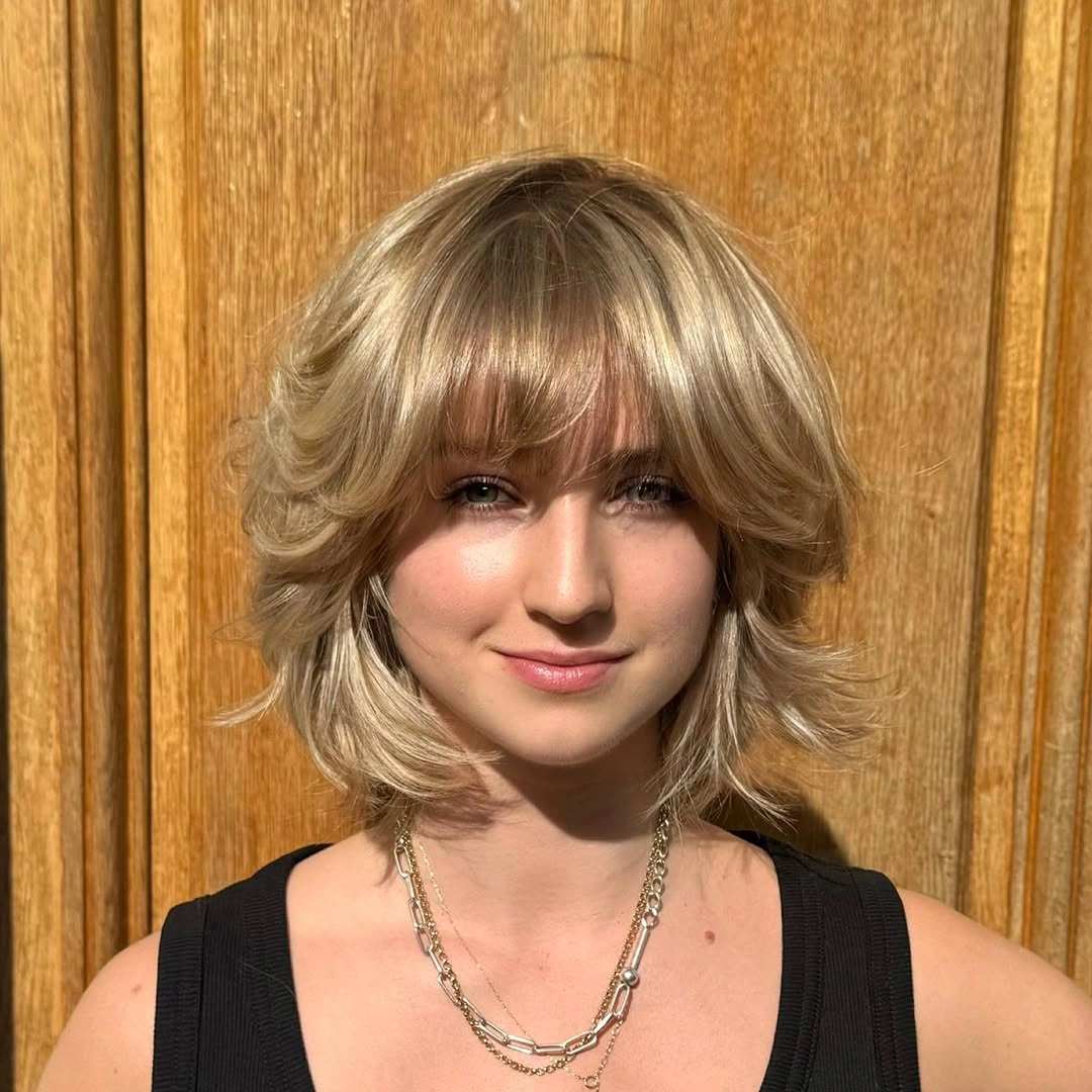 Fall hairstyles for short hair 2026 Layered Butterfly Bob With Airy Curtain Bangs