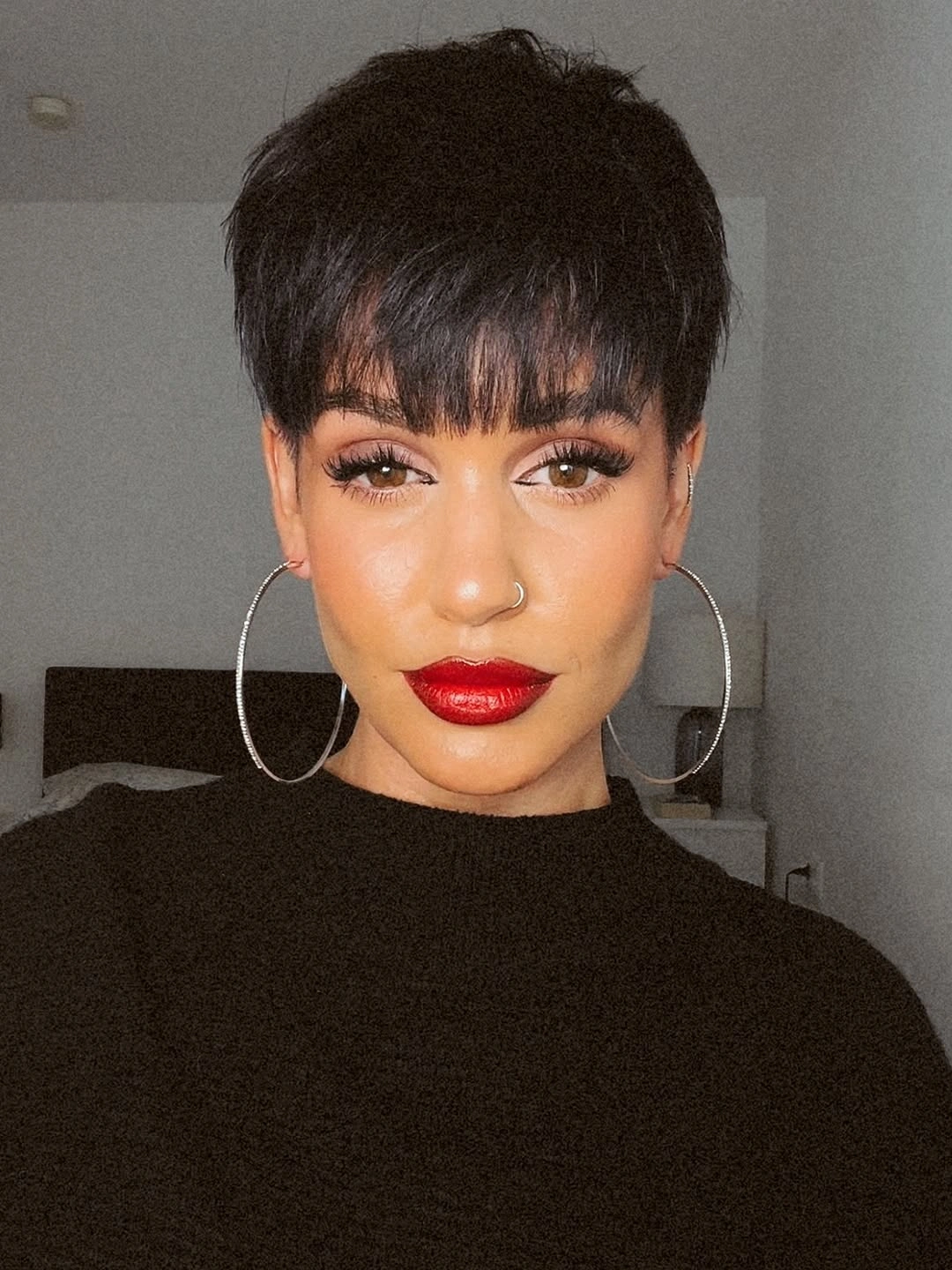 Fall hairstyles for short hair 2026 French-Inspired Dark Pixie With Feathered Fringe