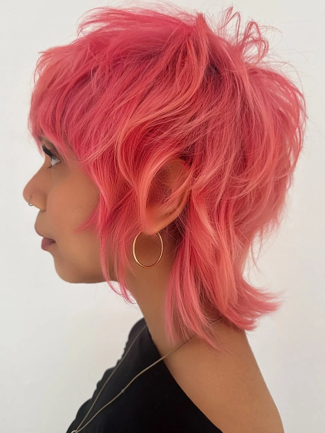 Fall hairstyles for short hair 2026 Playful Pink Shag That Brightens Gray Fall Days