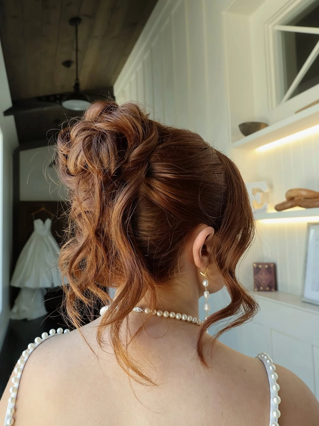 Fall hairstyles for wedding guests 2026 Romantic Copper Updo With Cascading Face-Framing Curls