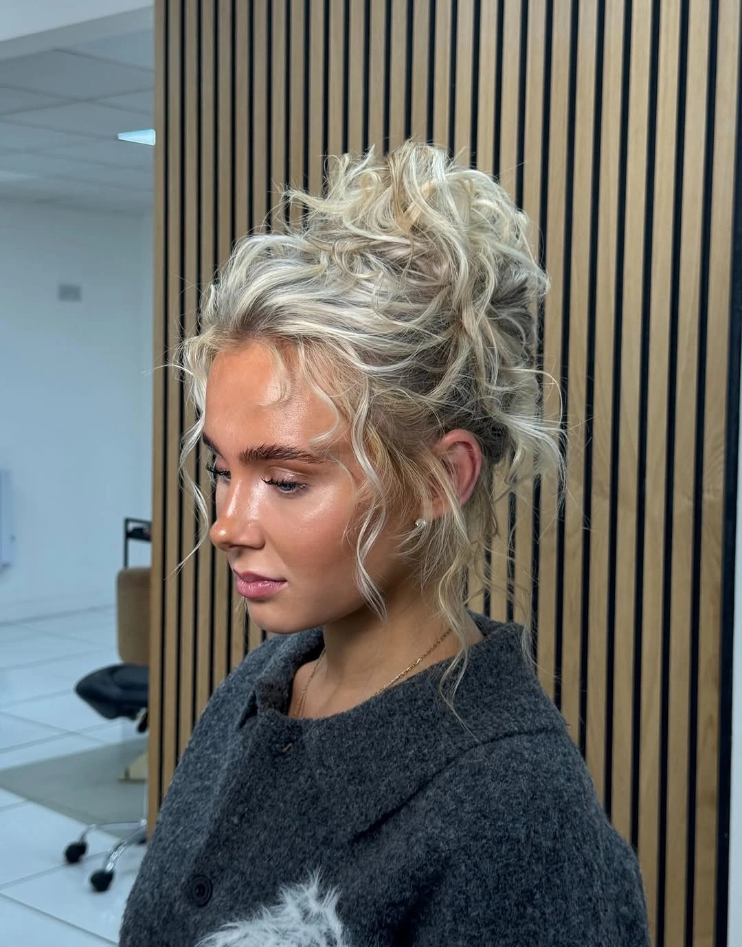 Fall hairstyles for wedding guests 2026 Soft Textured Updo With Effortless Curly Volume